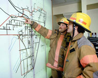 firemen looking at map photo